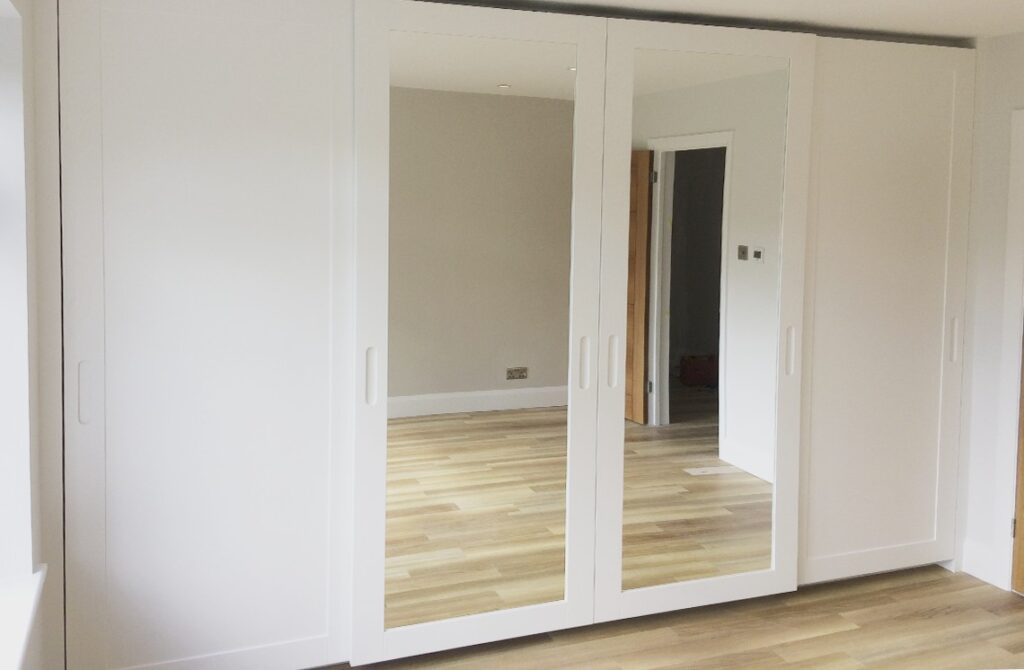 Mirrored fitted sprayed sliding doors in London, Urban Wardrobes