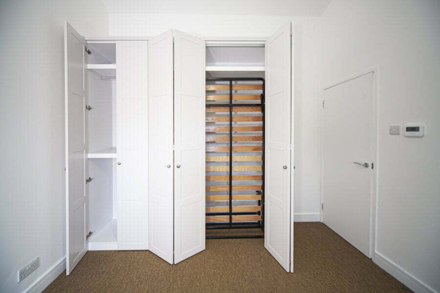 Shaker wardrobe with pull down bed mechanism